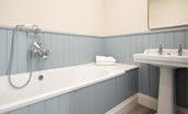Riverhill Cottage - master bedroom en suite bathroom with bath with handheld shower mixer tap